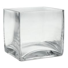 a square glass vase sitting on top of a table