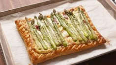 asparagus and cheese puff pastry on parchment paper