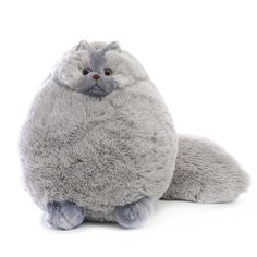 a gray stuffed animal sitting on top of a white floor