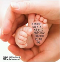 a hand holding a baby's foot with the words if you don't believe in