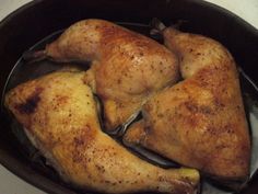 two pieces of chicken in a pan on the stove