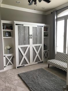 a living room filled with furniture and a large sliding door in front of a window