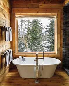 an image of a bathroom with a tub and window in the middle, on instagram