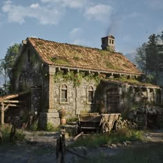 an old stone house with ivy growing on the roof