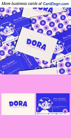 some business cards are stacked on top of each other with the word dora printed on them