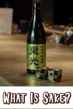 a beer bottle sitting on top of a wooden table