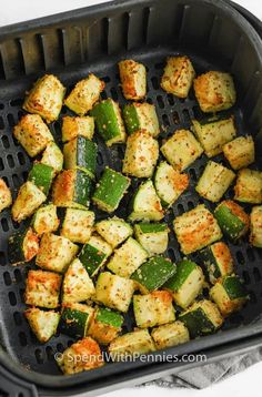 cooked zucchini cubes in an air fryer