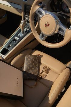 the interior of a luxury car with an electronic device