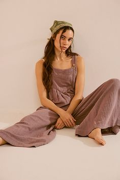 Lightweight woven overalls from our free-est collection. * Slouchy silhouette * Adjustable straps with coconut buttons * Front bib pocket * Pleat detailing * Hip pockets * Single back patch pocket * Wide-legs | Sun-Drenched Overalls by free-est at Free People in Purple, Size: S Summer Cottagecore Outfits, Cute Overall Outfits, Boho Overalls, Linen Overalls, Overall Outfit, Overalls Outfit, Cottagecore Outfits, Artist Outfit, Back Patch