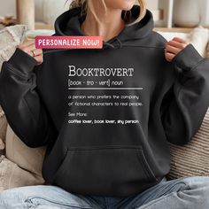 Bookish Sweatshirt, Custom Booktrovert Definition, Book Sweatshirt, Bookish Shirt, Teacher Sweatshirt, Bookish Gifts, Teacher Shirt Stay in style and comfort with our chic and adaptable collection of hoodies, sweatshirts, and t-shirts. Meticulously crafted using the finest materials, our apparel seamlessly combines fashion and comfort. Explore a range of captivating designs that reflect your individuality and enhance your wardrobe with these essential pieces suitable for any casual occasion. Int Gifts Book, Book Shirt, Teacher Sweatshirt, Gifts Teacher, Book Shirts, Bookish Gifts, Book Reader, Book Lovers Gifts, Teacher Shirts