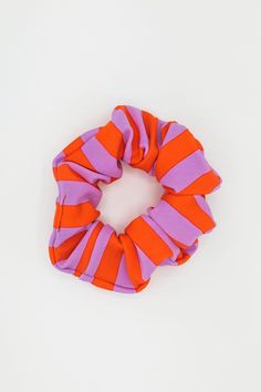 A scrunchie made to match your favorite swim styles. This classic, thick scrunchie is made of Nylon Spandex for a playful look that keeps your hair from creasing. Just like our matching swimsuits, our scrunchies are made in the USA by experienced sewers earning up to $20 an hour or more. Orange Orchid, Scrunchie Styles, Los Angeles Apparel, Bus Pass, Garment Manufacturing, 401k, Fashion Inspiration Design, Swim Fashion, Neon Orange