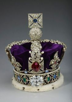 a crown with jewels and pearls on it