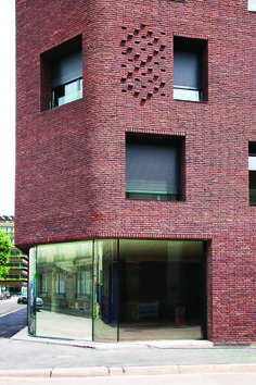 a tall brick building with lots of windows