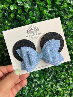 Chunky Glitter Minnie Hair Bow Ears Available in 2 Sizes: * Medium: 3" Bow, attached to an alligator clip with teeth. * Large: 4" Bow, attached to an alligator clip with teeth. Each item comes beautifully presented on a bow card and sealed in a protective cellophane bag. For sneak peeks, special offers, and giveaways, follow us on Instagram @RoyaltyRose.Boutique Minnie Mouse Hair, Minnie Mouse Hair Bows, Mouse Hair, Blue Mouse, Minnie Bow, Minnie Party, Rose Boutique, Glitter Bow, Cellophane Bags