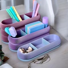 an assortment of colorful toothbrushes and other items on a table