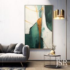 a living room scene with focus on the couch and coffee table, which has a large abstract painting hanging above it