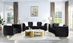 a living room filled with black and white furniture