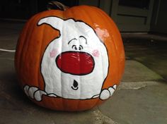 a pumpkin with a cartoon character painted on it