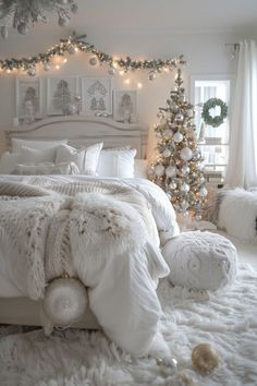 a white bedroom decorated for christmas with lights