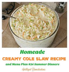 a close up of a bowl of coleslaw on a table with a spoon