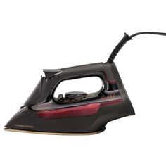 a black and red steam iron on a white background with clippings to the side