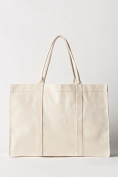 A tote bag in 100% cotton with Soft Goat logo embroidered on both sides. Inside pocket. Hand wash only. Goat Logo, Canvas Bag Design, Beige Tote Bag, White Tote Bag, Bag Mockup, White Tote, Shopper Bag, Tote Bag Design, White Bag