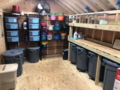 a room filled with lots of buckets and bins on the shelves next to each other