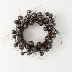 a close up of a wreath made out of metal balls