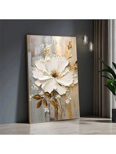 a large white flower painting on a wall next to a potted plant