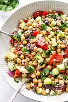 a salad with chickpeas, cucumbers and tomatoes