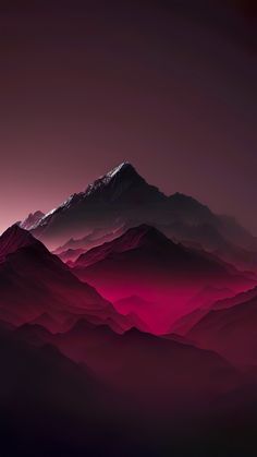 the mountains are covered in red and purple hazes as if they were foggy