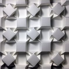 an abstract wall made up of white cubes