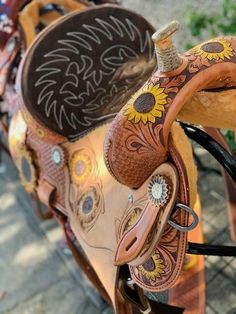 the saddle is decorated with sunflowers and other decorative things to decorate on it