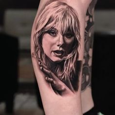 a woman's arm with a tattoo on it