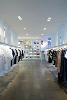 a clothing store filled with lots of white shirts