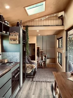 the interior of a tiny home with wood flooring