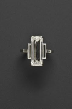 an emerald - cut diamond ring