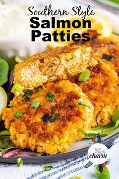 two crab cakes on a plate with greens and lemon wedges in the background text reads southern style salmon patties