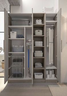 an organized closet with clothes, baskets and other items in it's storage area