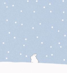 a white rabbit sitting on top of a snow covered hill under a blue sky with stars