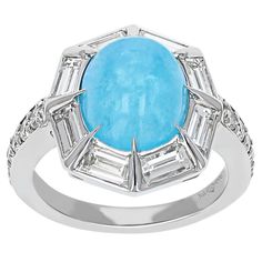 This is a Truly Unique Ring! This Juleve Inspired Design Features an elegant 6.14 Carat Total Weight Cabochon Hemimorphite That Is Surrounded By 1.45 Carats Total Weight Of Baguette Diamonds And 0.37 Carats Of Round Side Diamonds. The Ring Is Crafted In 18 Karat White Gold . This One Of A Kind Juleve Ring Was Proudly Designed & Manufactured In The U.S.A. Baguette Diamonds, Timeless Gifts, Childrens Jewelry, Matching Rings, Unique Ring, Rings Wedding, Classic Ring, Baguette Diamond, Blue Rhinestones