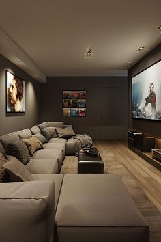 a living room filled with lots of furniture and a flat screen tv mounted to the wall