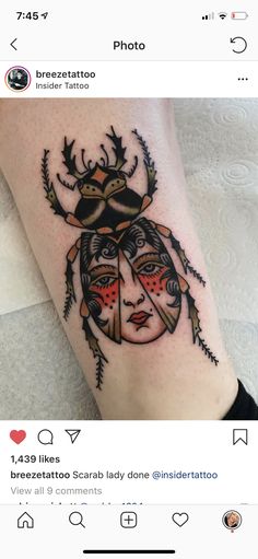 a lady bug tattoo on the left leg with an antelope in it's head