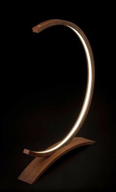 a light up letter c on a wooden stand