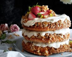 a stack of three pastries sitting on top of a plate covered in icing