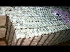 stacks of money sitting on top of each other