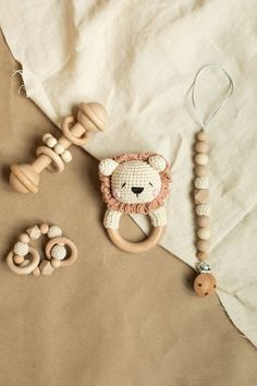 a wooden beaded toy and other toys on a sheet