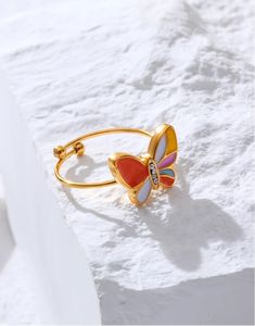 Creative Cute Colorful Enamel Mini Butterfly Rings - Stainless Steel 18K Gold Plated Waterproof Jewelry for Women & Girls Discover the charm of the Creative Cute Colorful Enamel Mini Butterfly Rings, designed to add a playful touch to any jewelry collection. Crafted from high-quality stainless steel and plated with 18K gold, these rings offer both durability and a luxurious finish. The vibrant enamel butterflies bring a burst of color, making these rings a delightful addition to your accessory w Pink Enamel Ring As A Gift, Yellow Enamel Ring, Gold Enamel Ring Perfect For Gifting, Gold Enamel Ring For A Gift, Gold Enamel Ring Perfect For Gift, Multicolor Enamel Open Ring, Multicolor Enamel Ring As Gift, Multicolor Enamel Ring For Gift, Adjustable Multicolor Enamel Rings