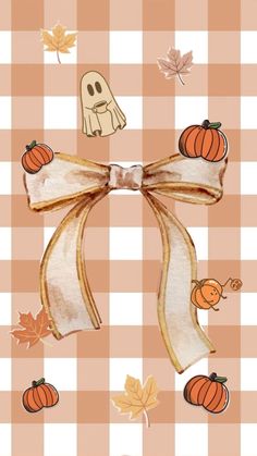 an image of a bow with pumpkins and ghost decorations on the front, as well as fall leaves