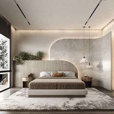 a large bed sitting in the middle of a bedroom next to a tall white wall